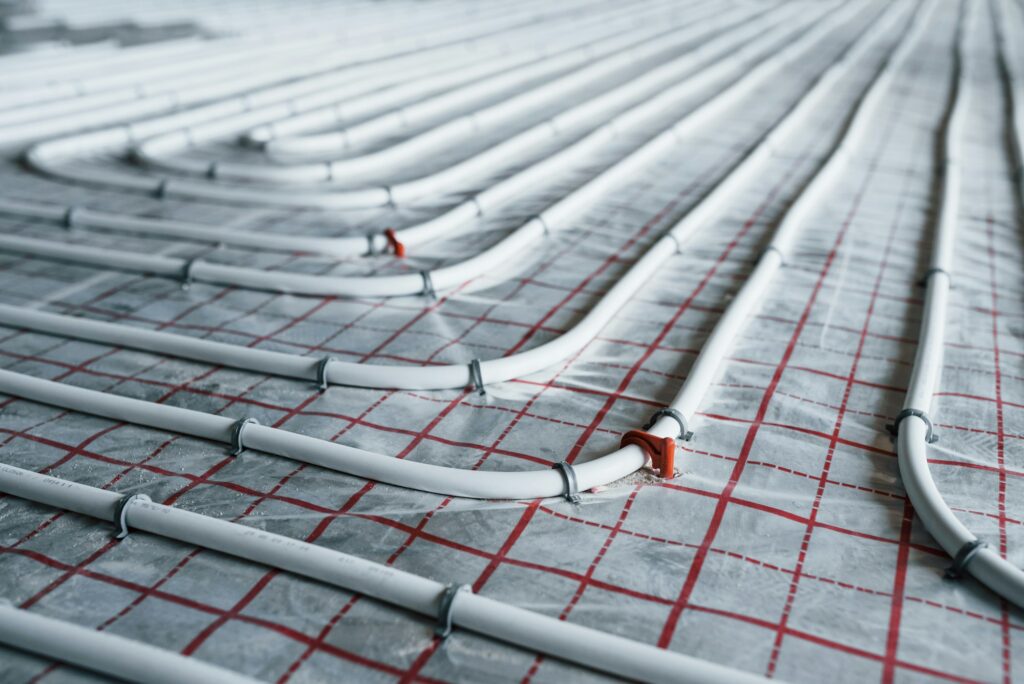 Pipes of underfloor heating system. Close up view. No people